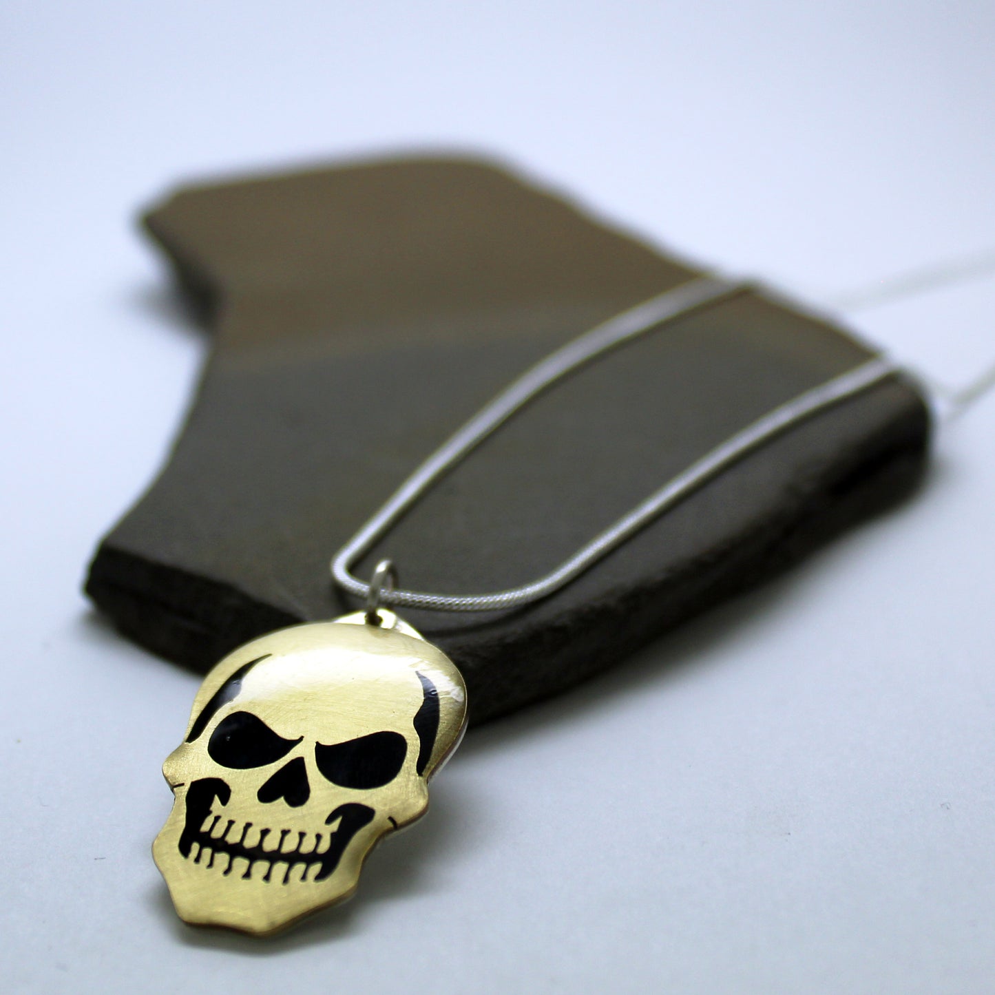 Colgante Calavera en latón y plata 925