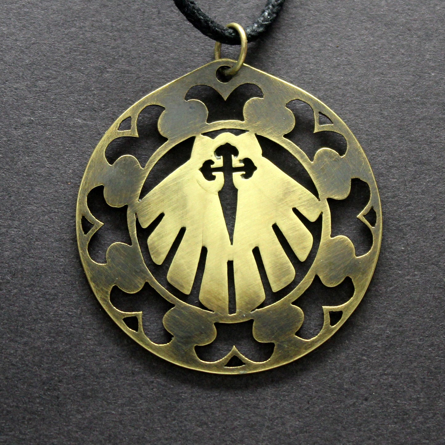 Shell medallion of the Camino and Cross of Santiago openwork in brass