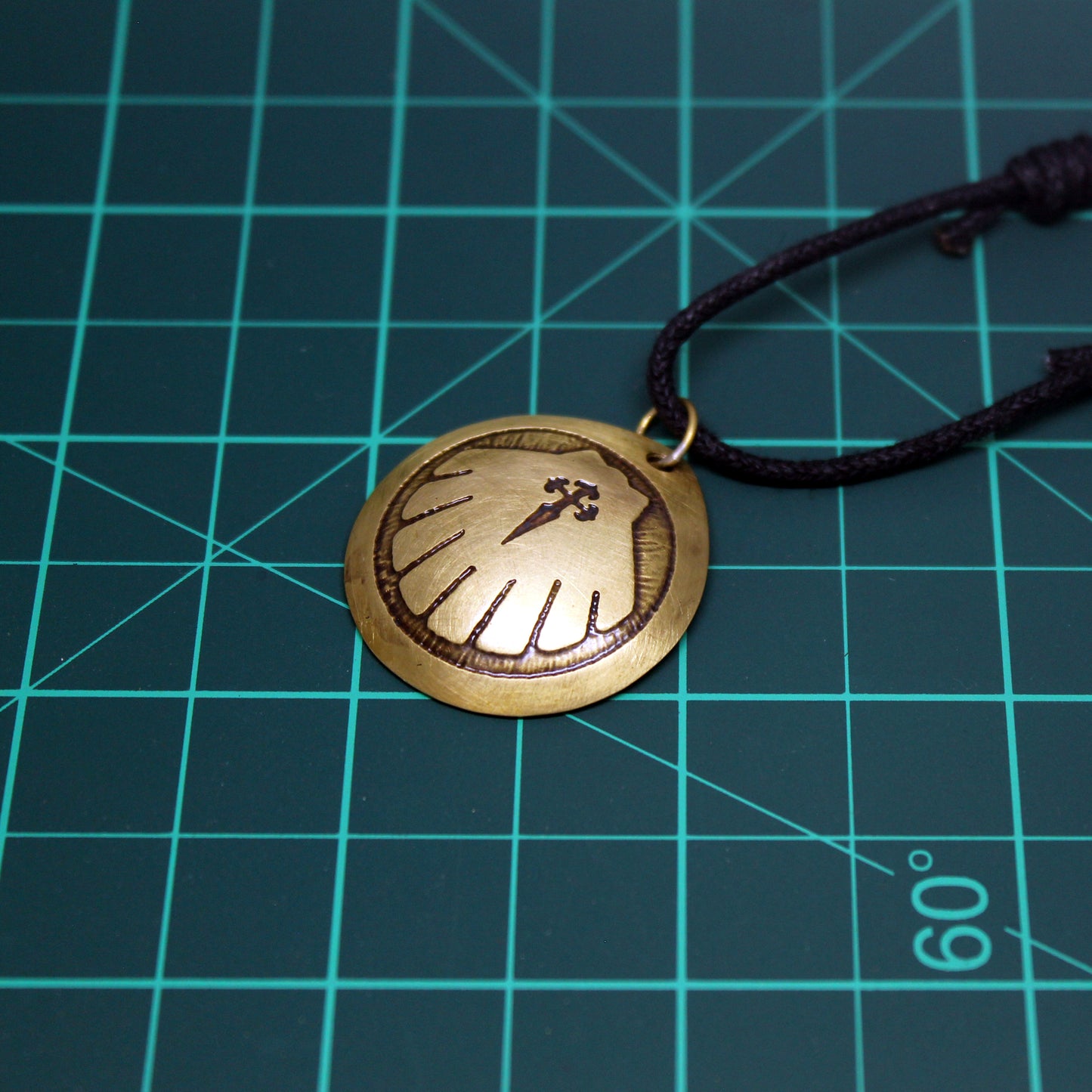 Engraved Camino de Santiago shell, brass pendant