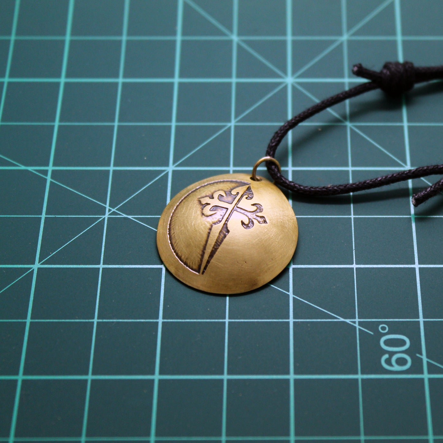 Cross of Santiago, convex brass pendant