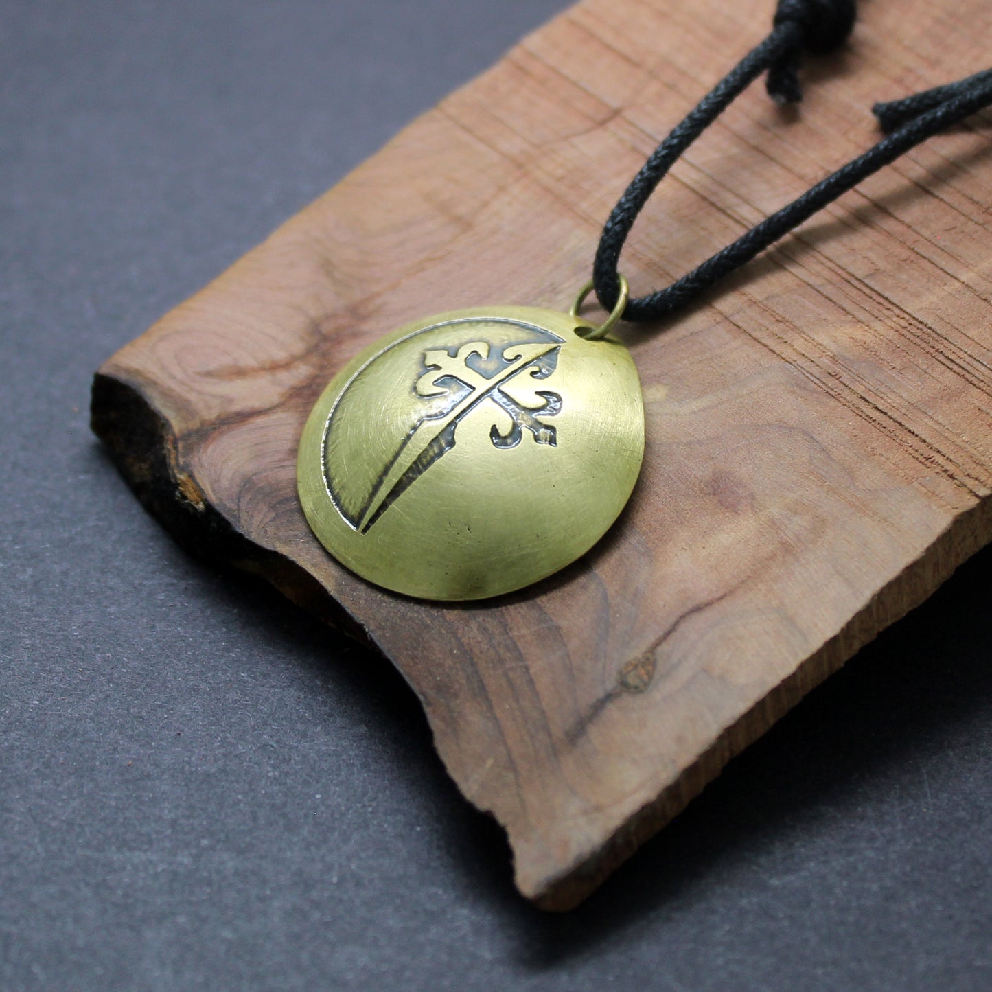Cross of Santiago, convex brass pendant