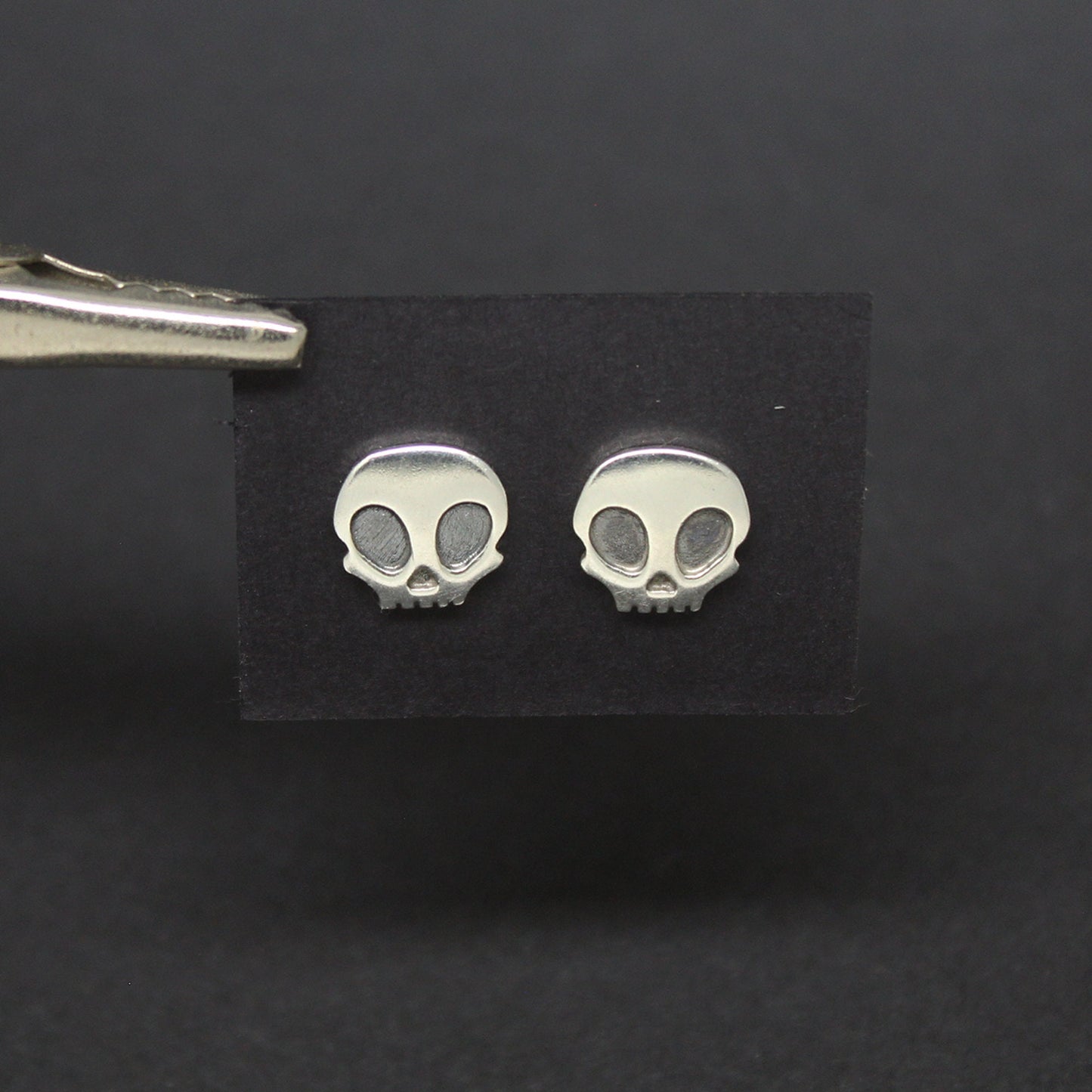 925 silver skull earrings with patina