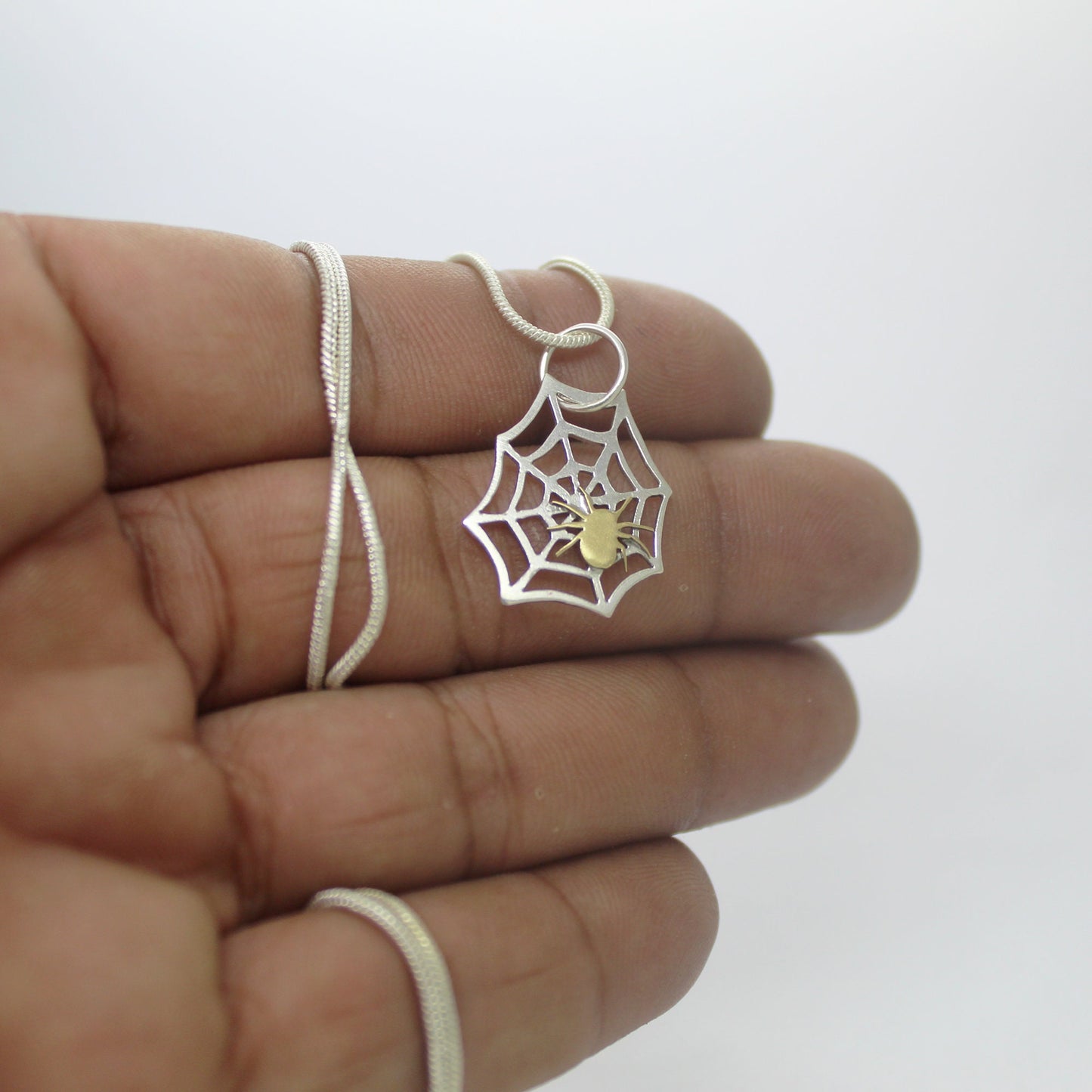 925 silver spider web pendant with brass spider
