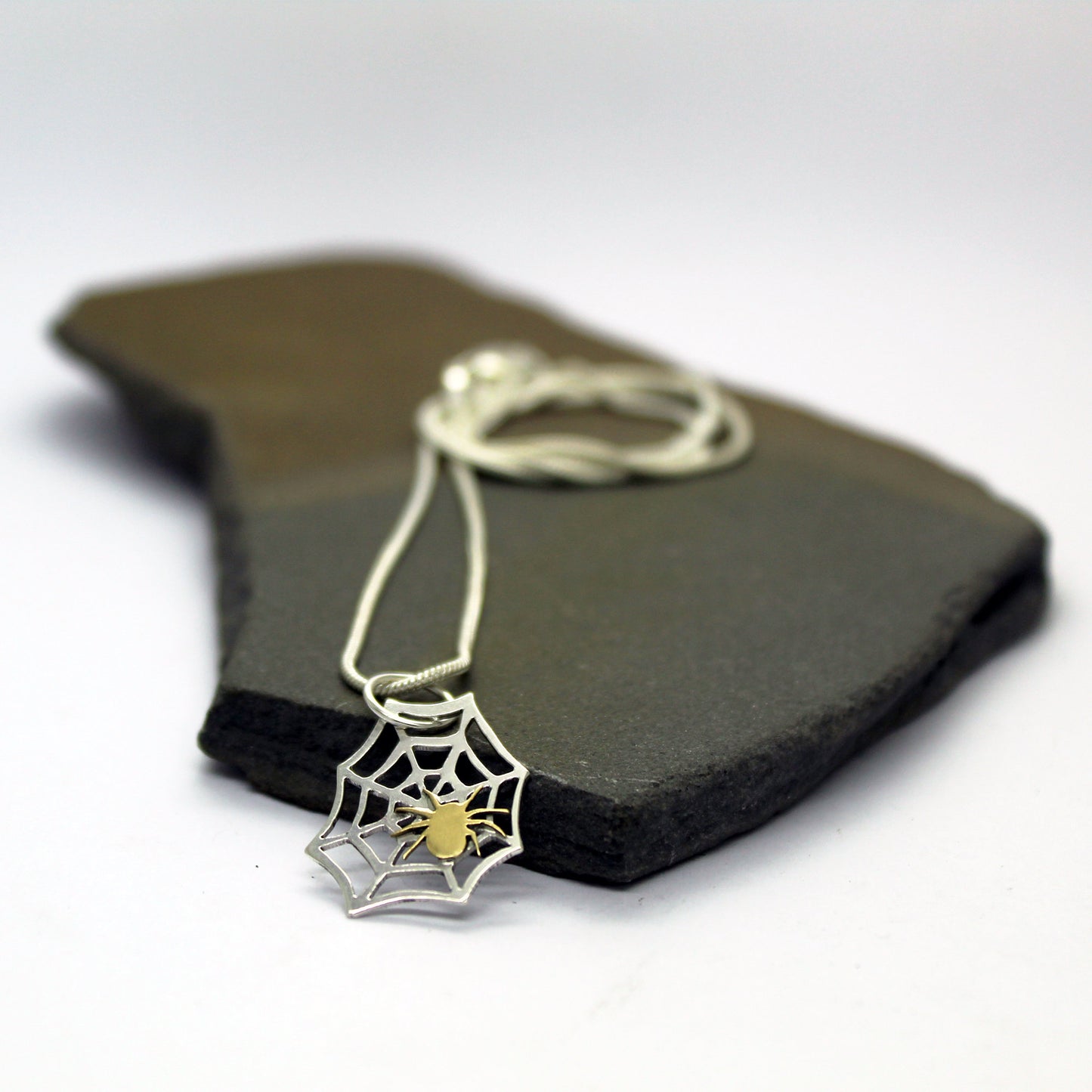 925 silver spider web pendant with brass spider