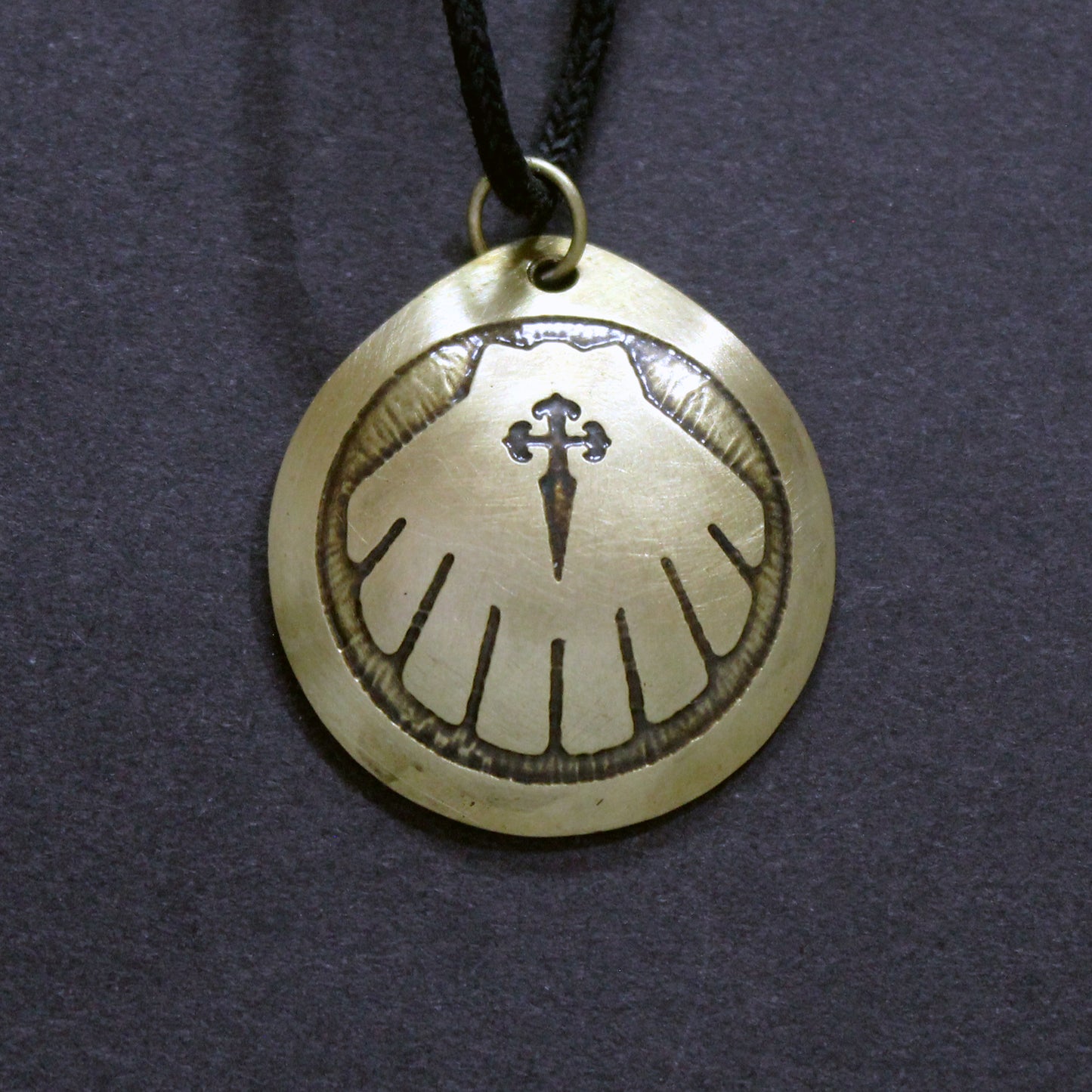 Engraved Camino de Santiago shell, brass pendant