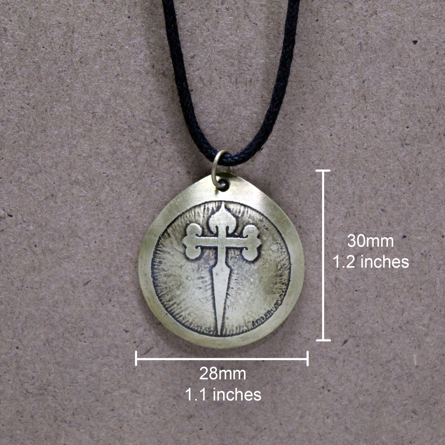 Brass pendant engraved with the Cross of Santiago