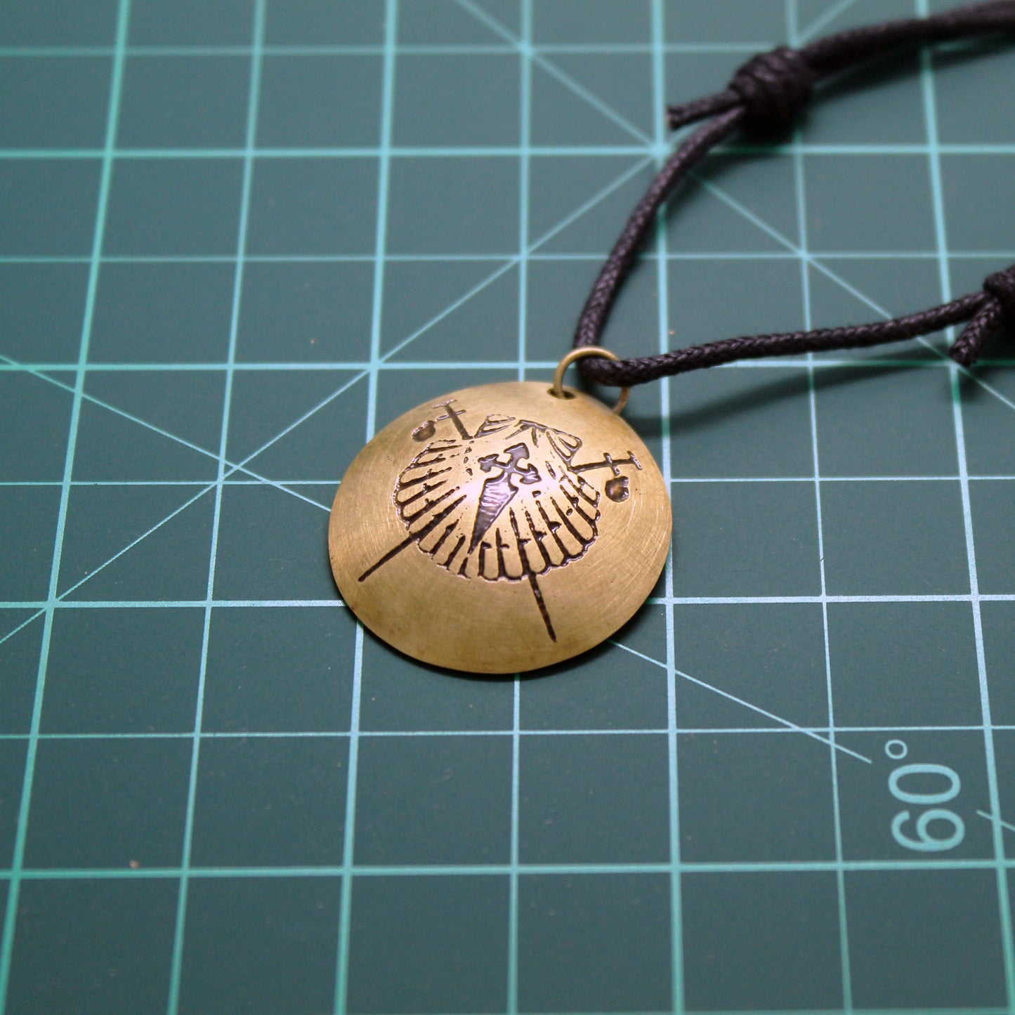 Symbols of the Camino de Santiago, convex brass pendant